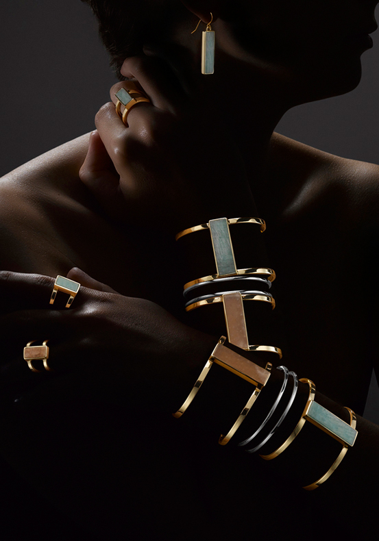 Photograph showing the new collection of gold bangles, rings and earrings with semi precious for London high street jewellery company